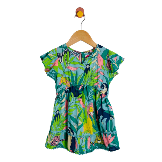 Colorful children's dress with animal print on a hanger against a white background