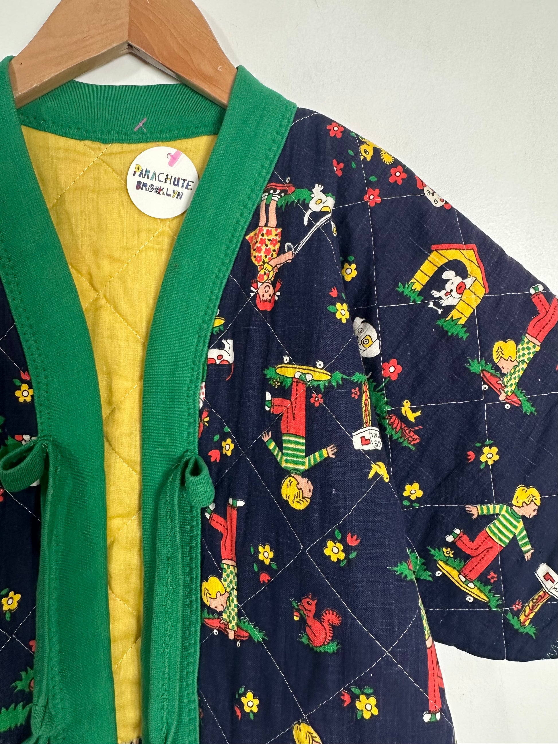 Children's jacket with colorful pattern on a hanger