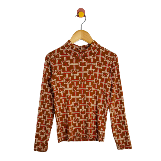 Brown sweater with geometric pattern on a wooden hanger against a white background