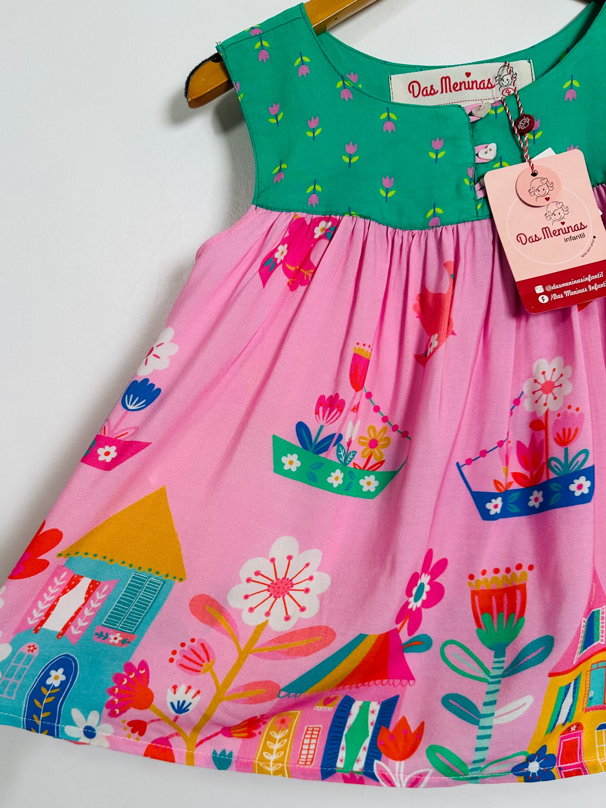 Colorful children's top with a tag on a white background