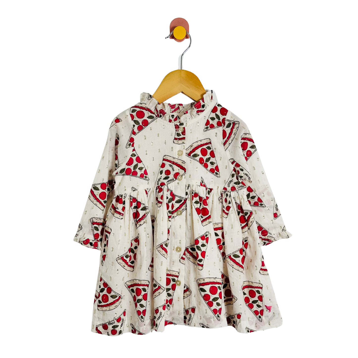 Children's dress with pizza pattern on a hanger against a white background