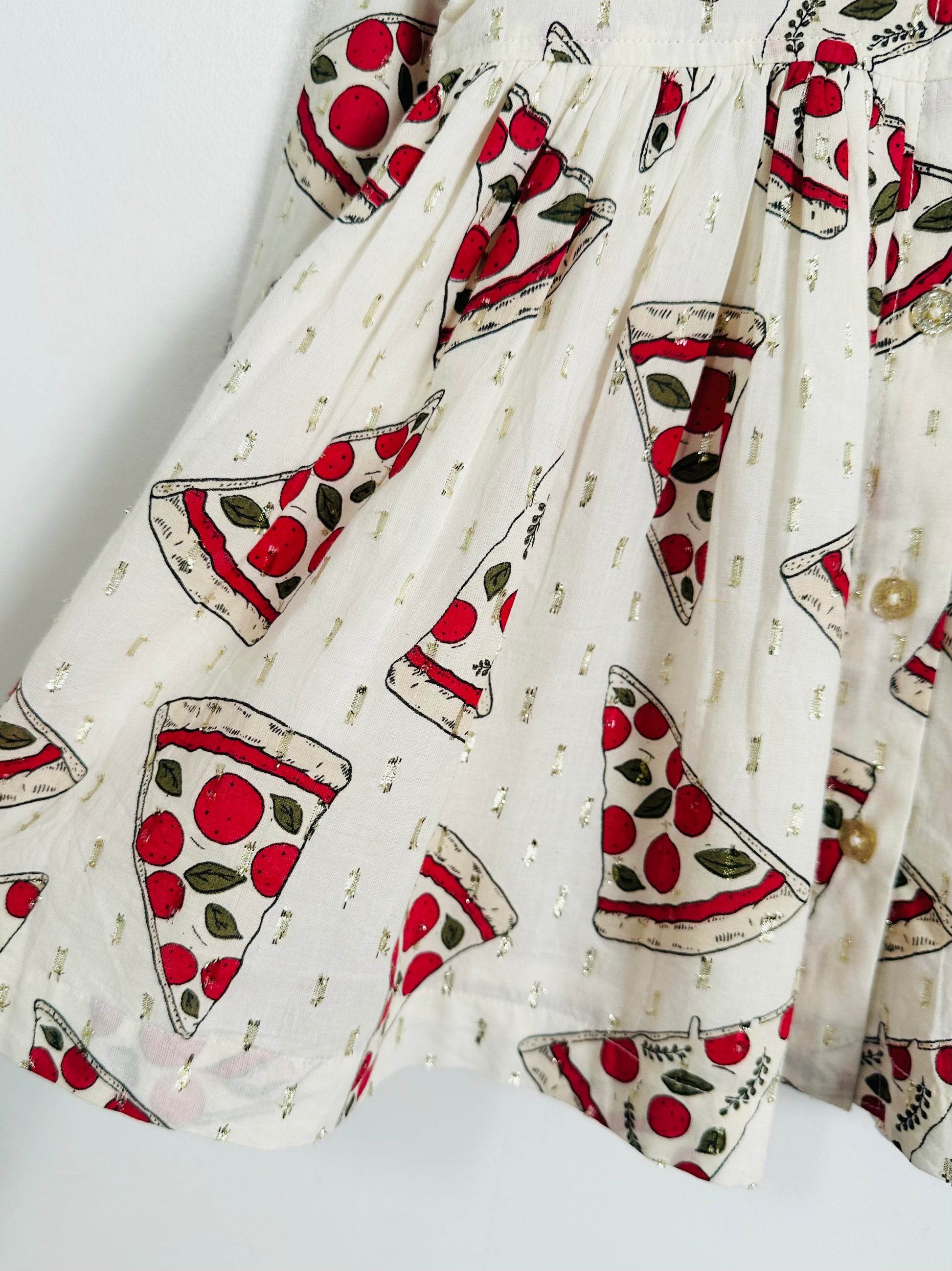 Fabric with pizza slice pattern on a white background
