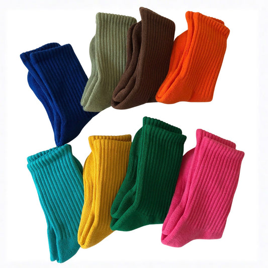 Set of colorful socks in various shades on a white background