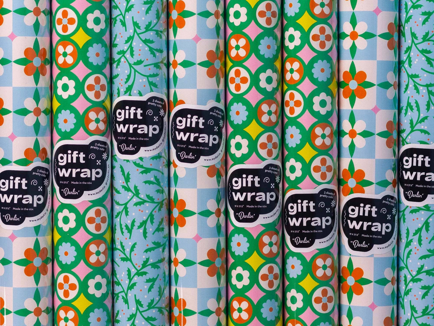 Collection of colorful gift wrap with floral patterns and 'gift wrap' labels.