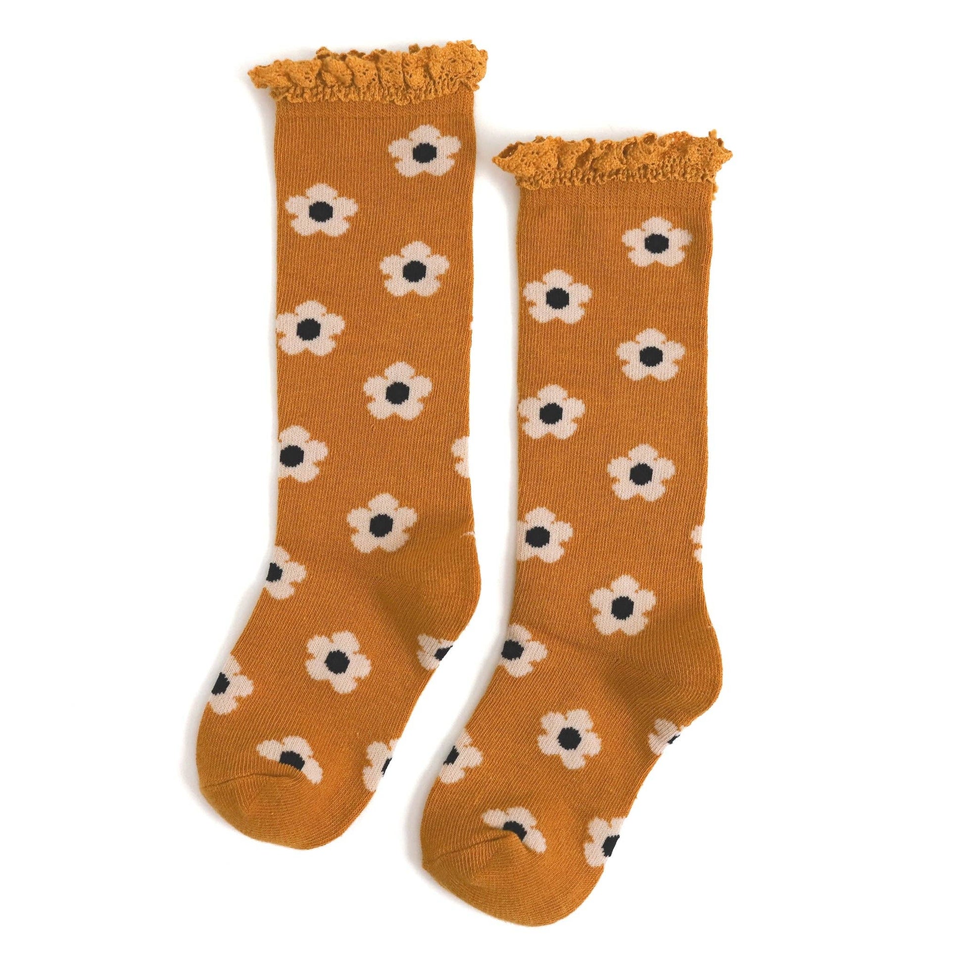 Pair of mustard yellow socks with white flower pattern on a white background