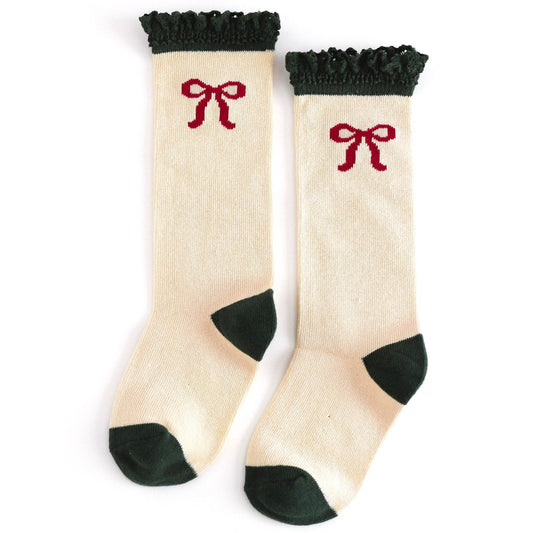 Pair of socks with red bows and black accents on a white background