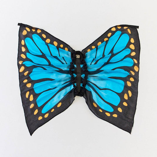 Butterfly wing costume with blue wings and black body on a white background