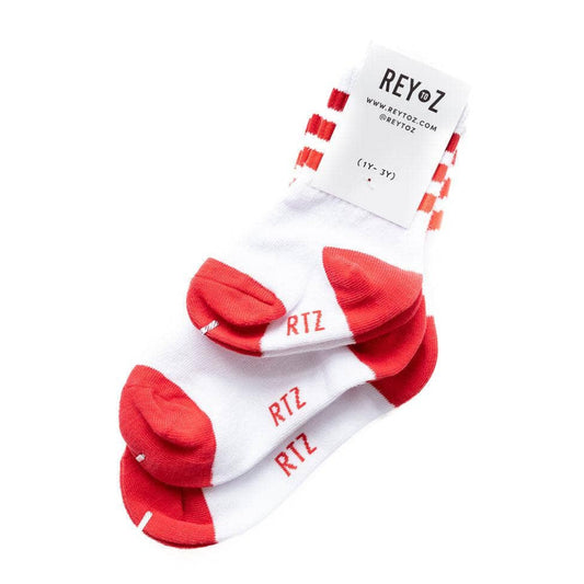 Red and white socks with 'Ritz' branding on a white background