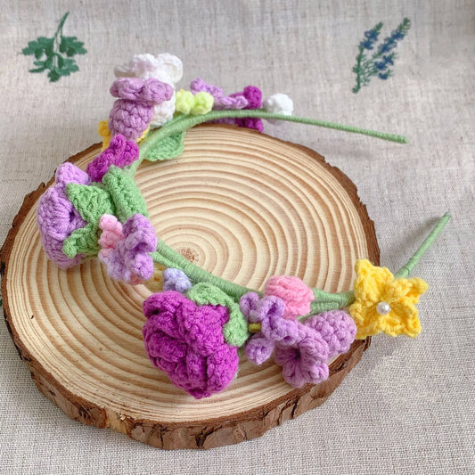 Crocheted flower headband on a wooden disc with a textured background
