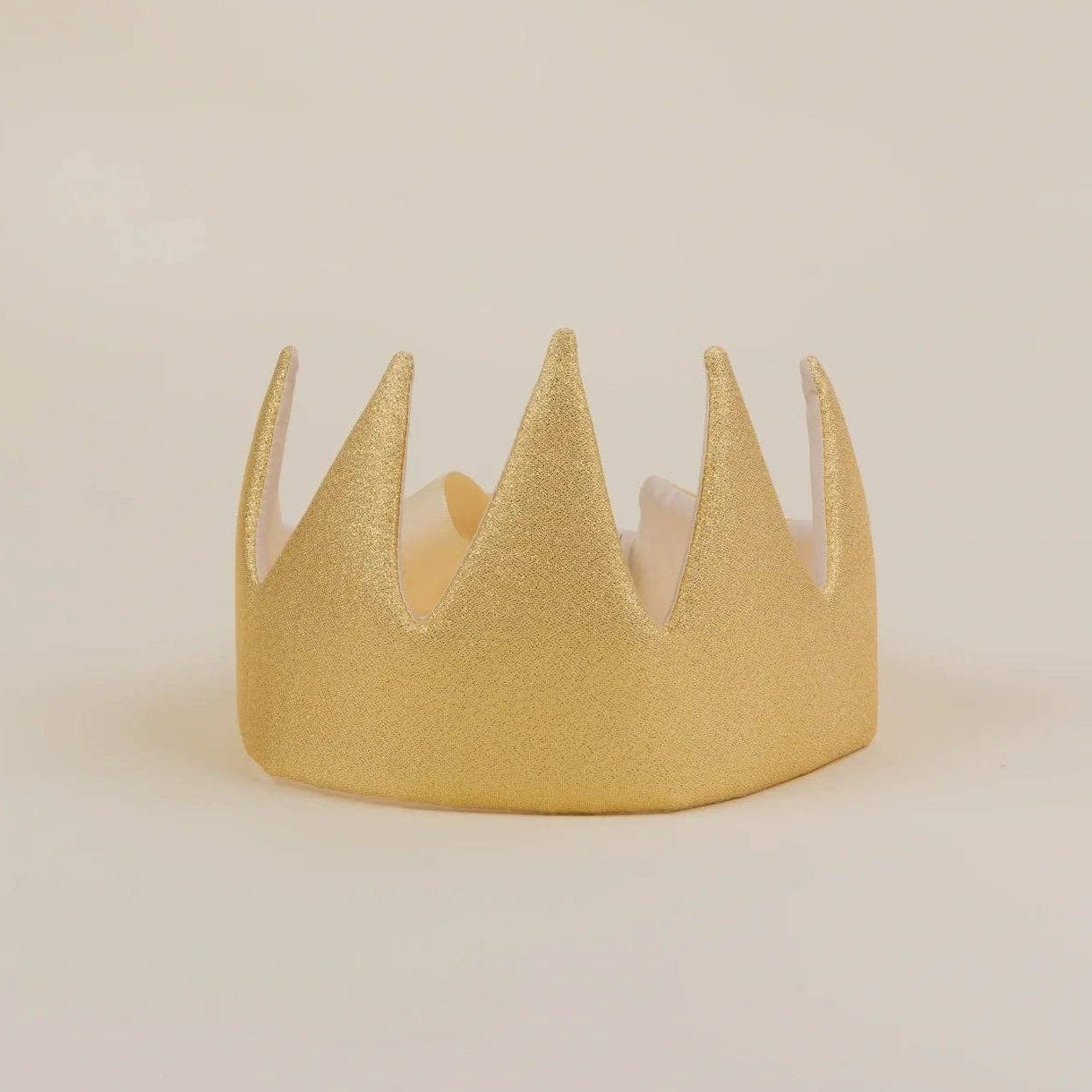 A small gold glitter crown