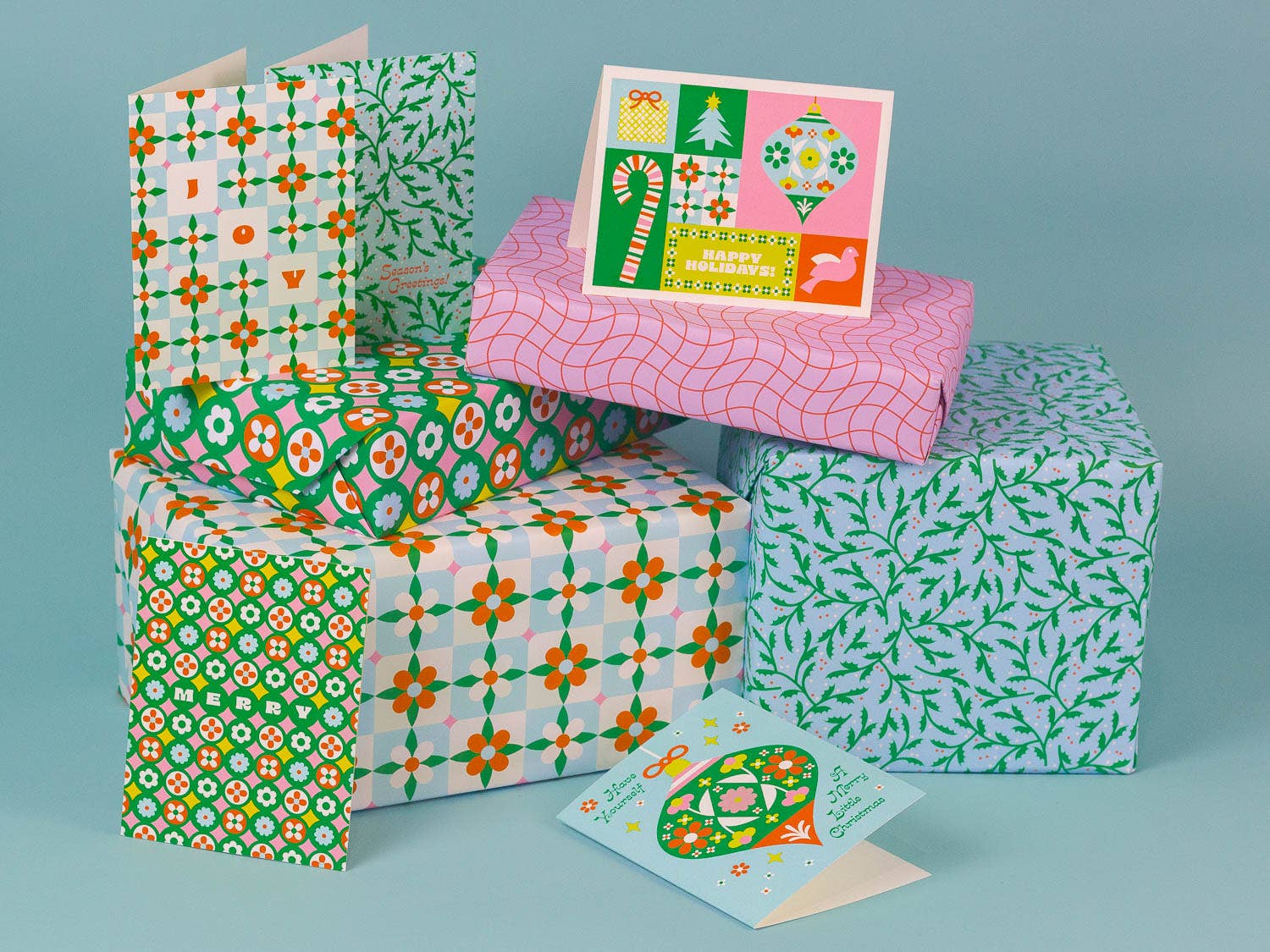 Gift boxes and cards with colorful patterns on a blue background