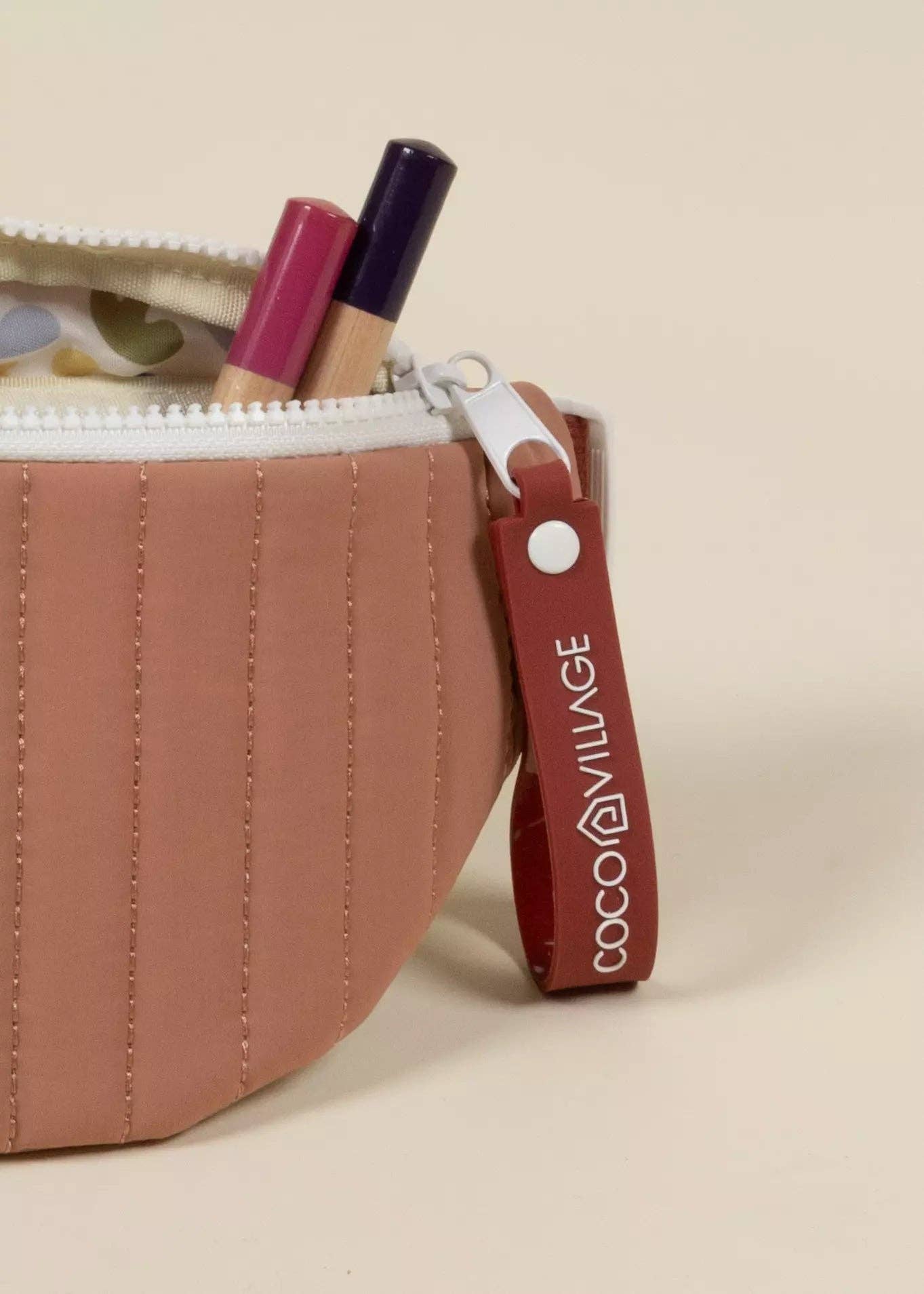 Bag with a visible brand tag on a beige background
