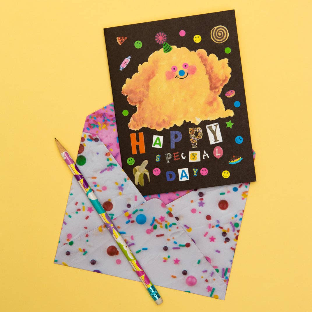 Greeting card with cartoon character and colorful pencil on a yellow background