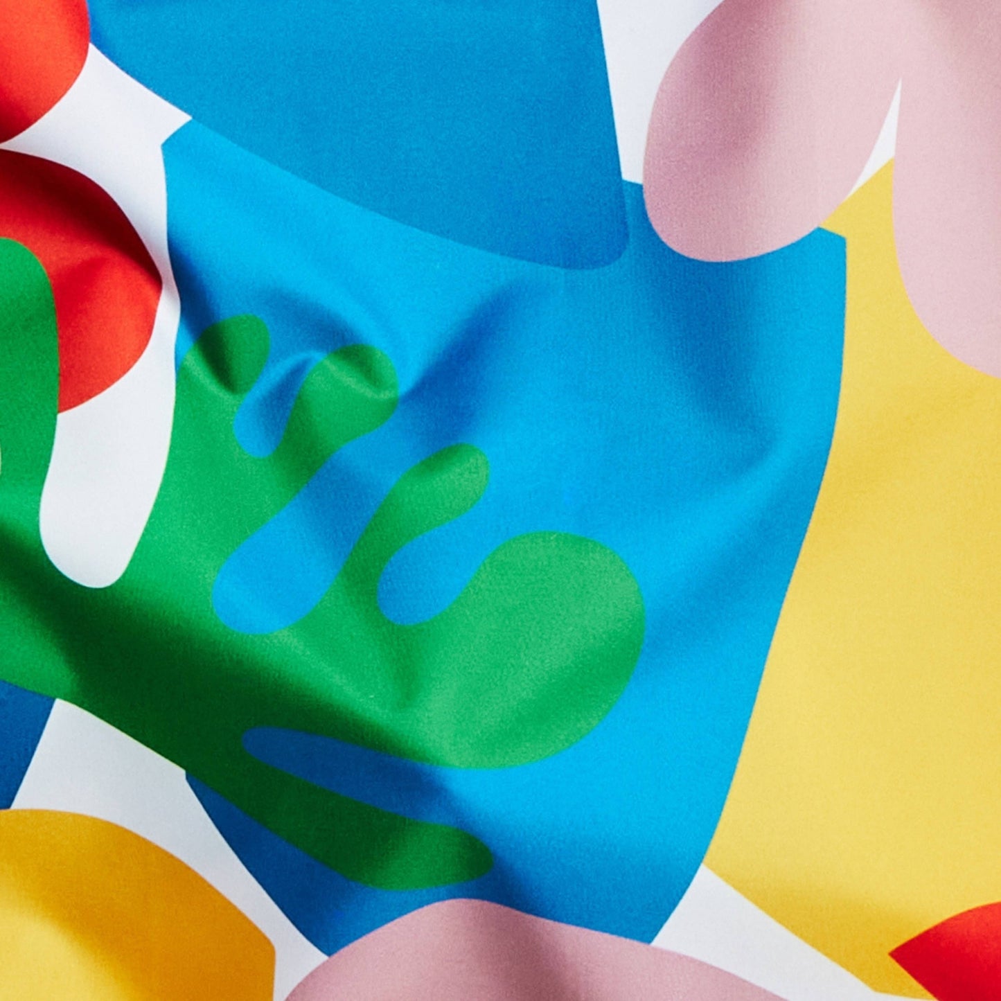 Colorful abstract pattern with shapes in red, blue, green, yellow, and pink.