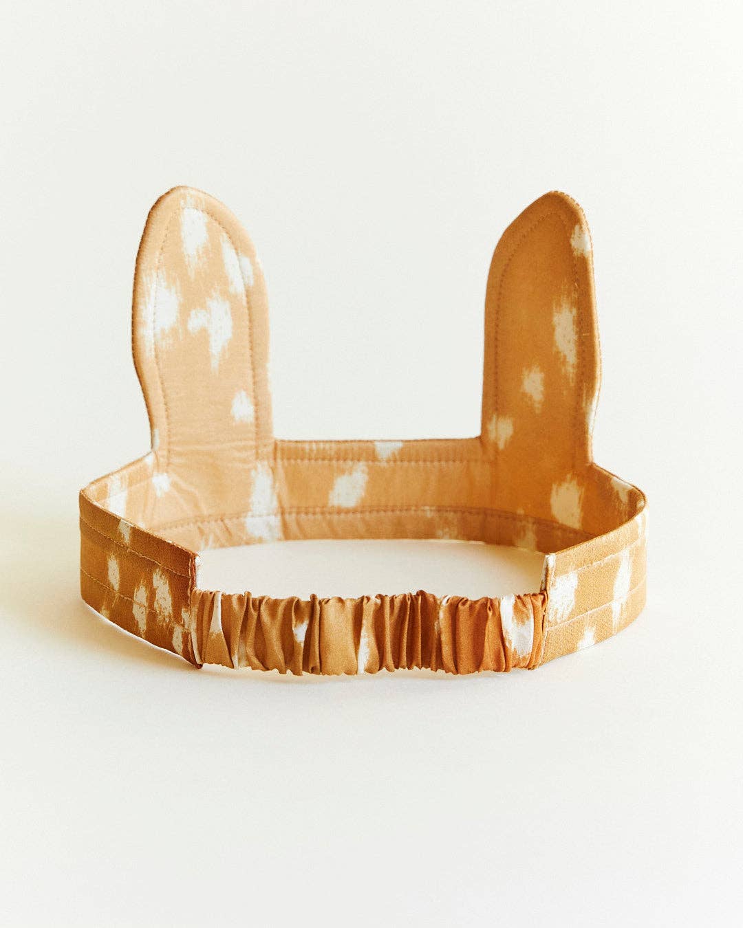 Headband with deer ear design on a white background