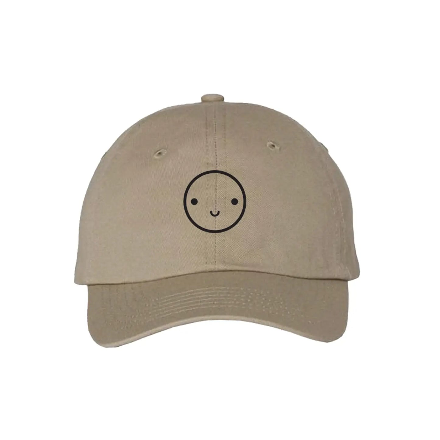 Beige cap with a smiley face design on a white background