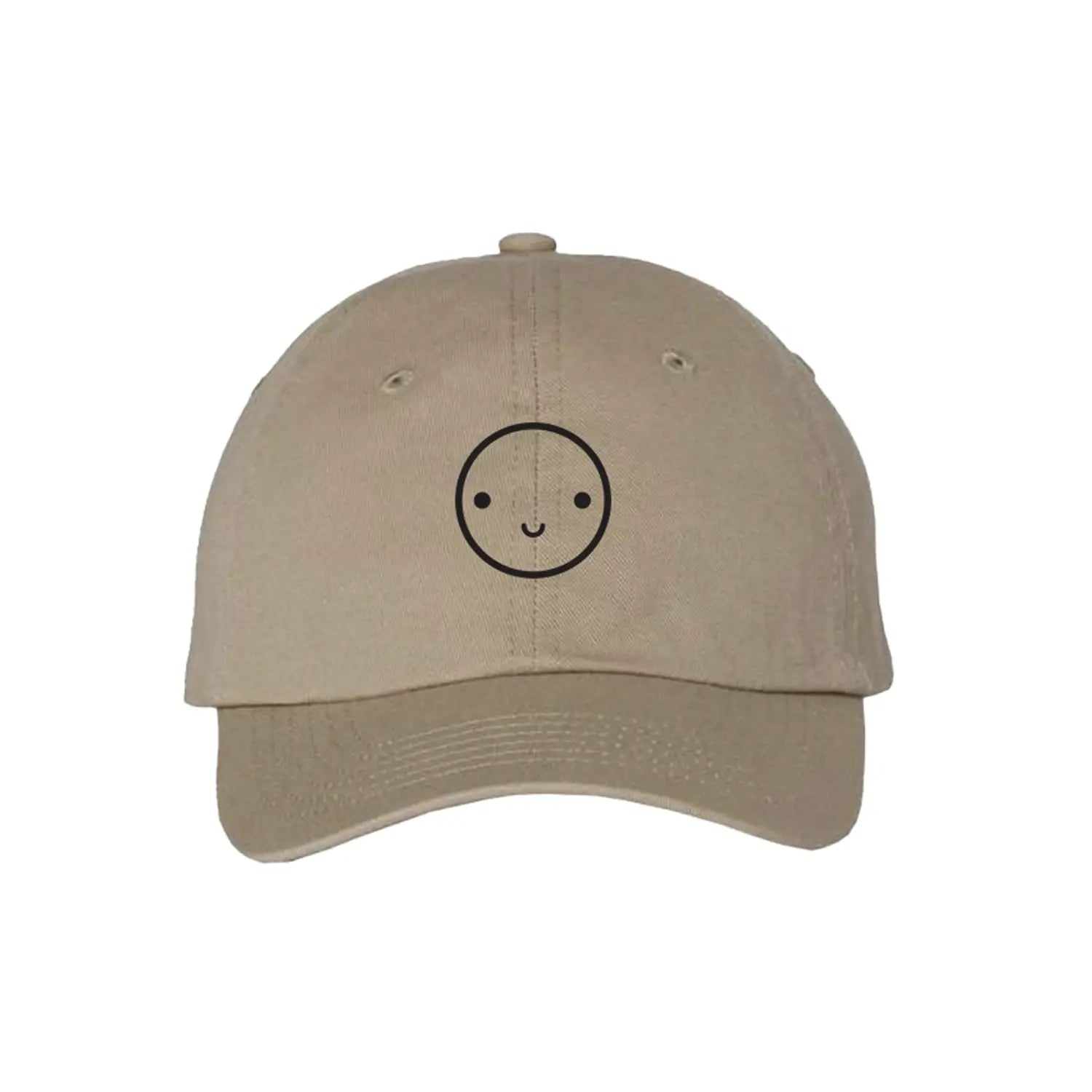 Beige cap with a smiley face design on a white background