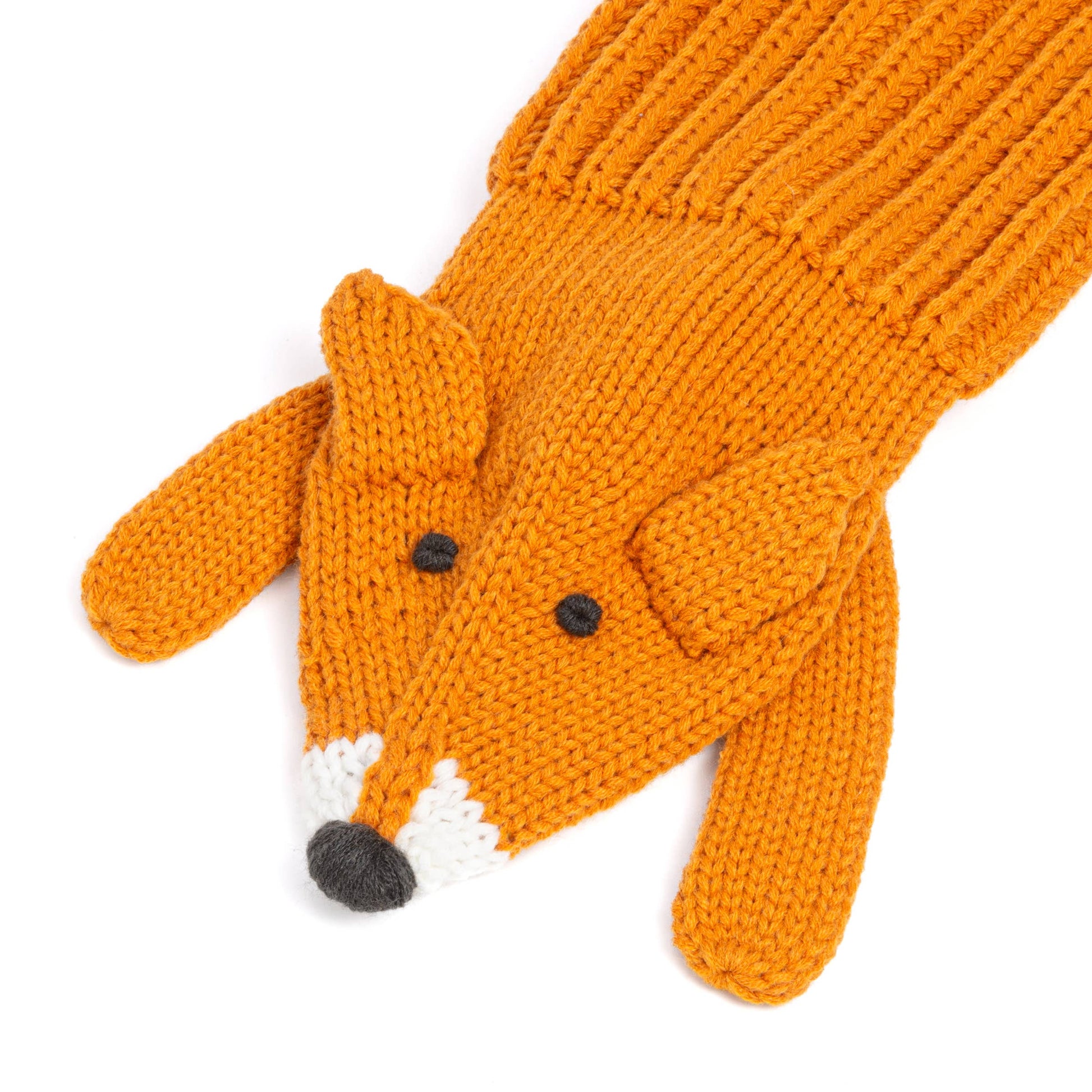 Knitted orange fox glove on a white background