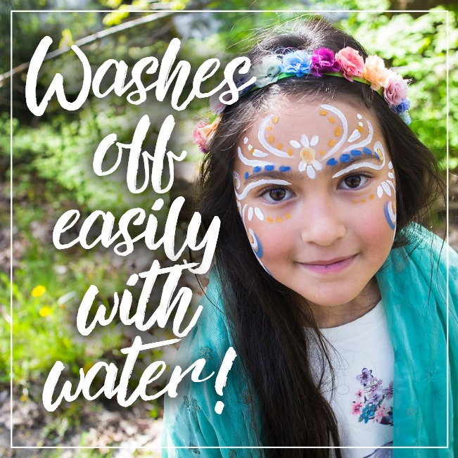 Young girl with face paint and floral headband outdoors, with text 'Washes off easily with water'.