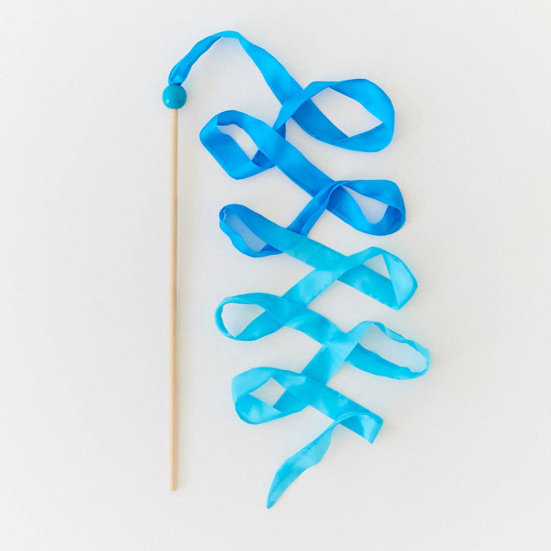 Blue ribbon on a wooden stick against a white background