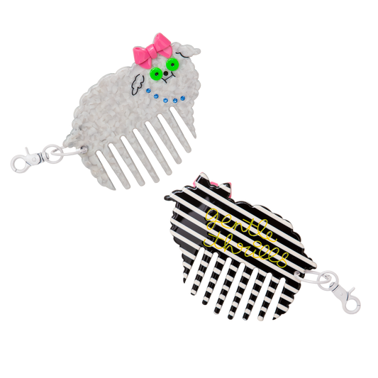 Two decorative hair combs with cartoon character designs on a white background