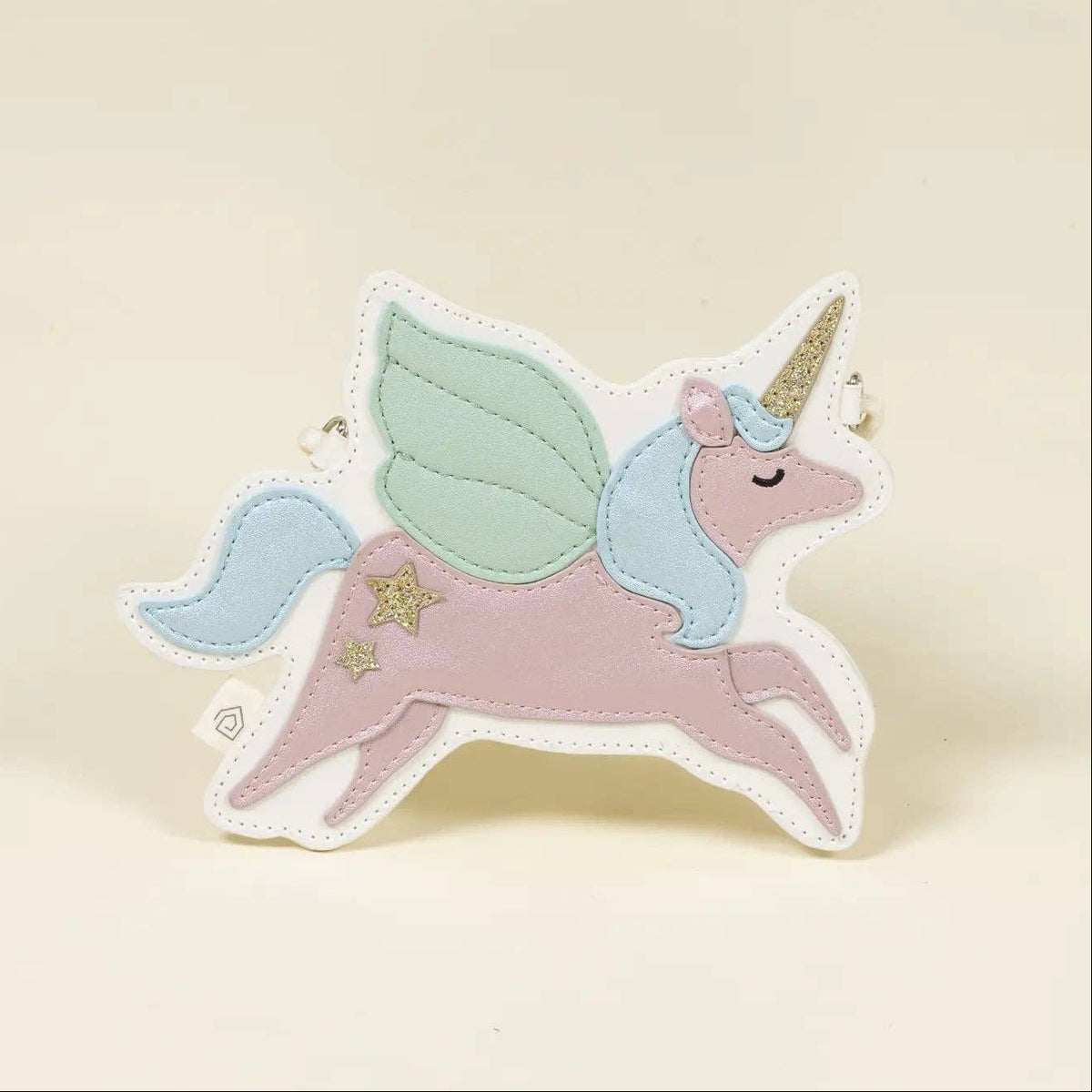 A whimsical felt unicorn bag featuring a pink body, mint green wings, a light blue mane and tail, and a gold horn, set against a solid cream background.