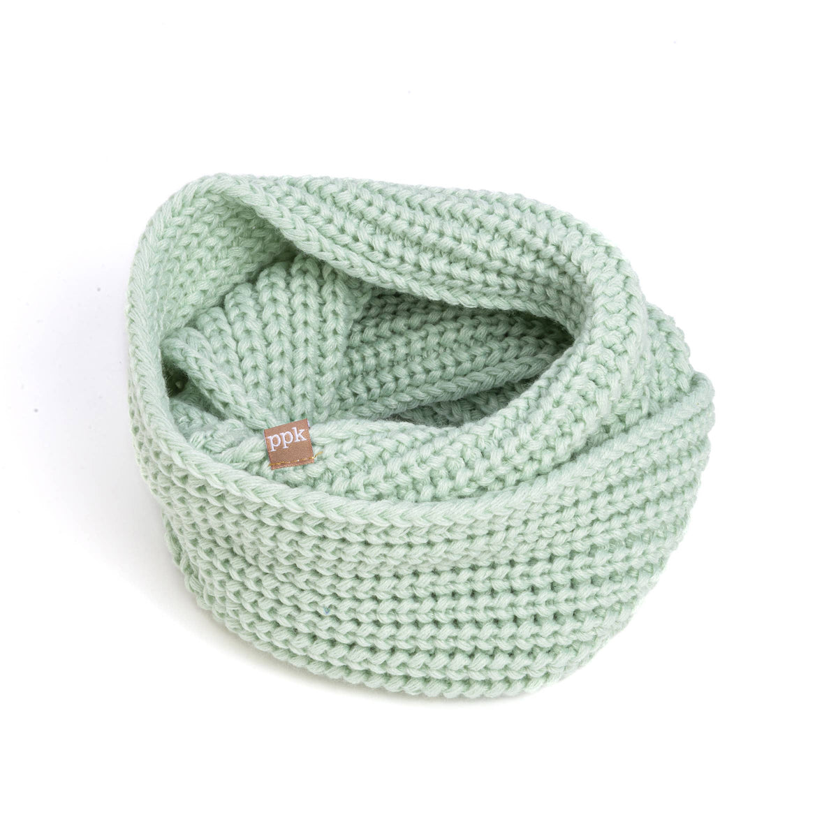 Light green knitted neck warmer with a brand tag on a white background