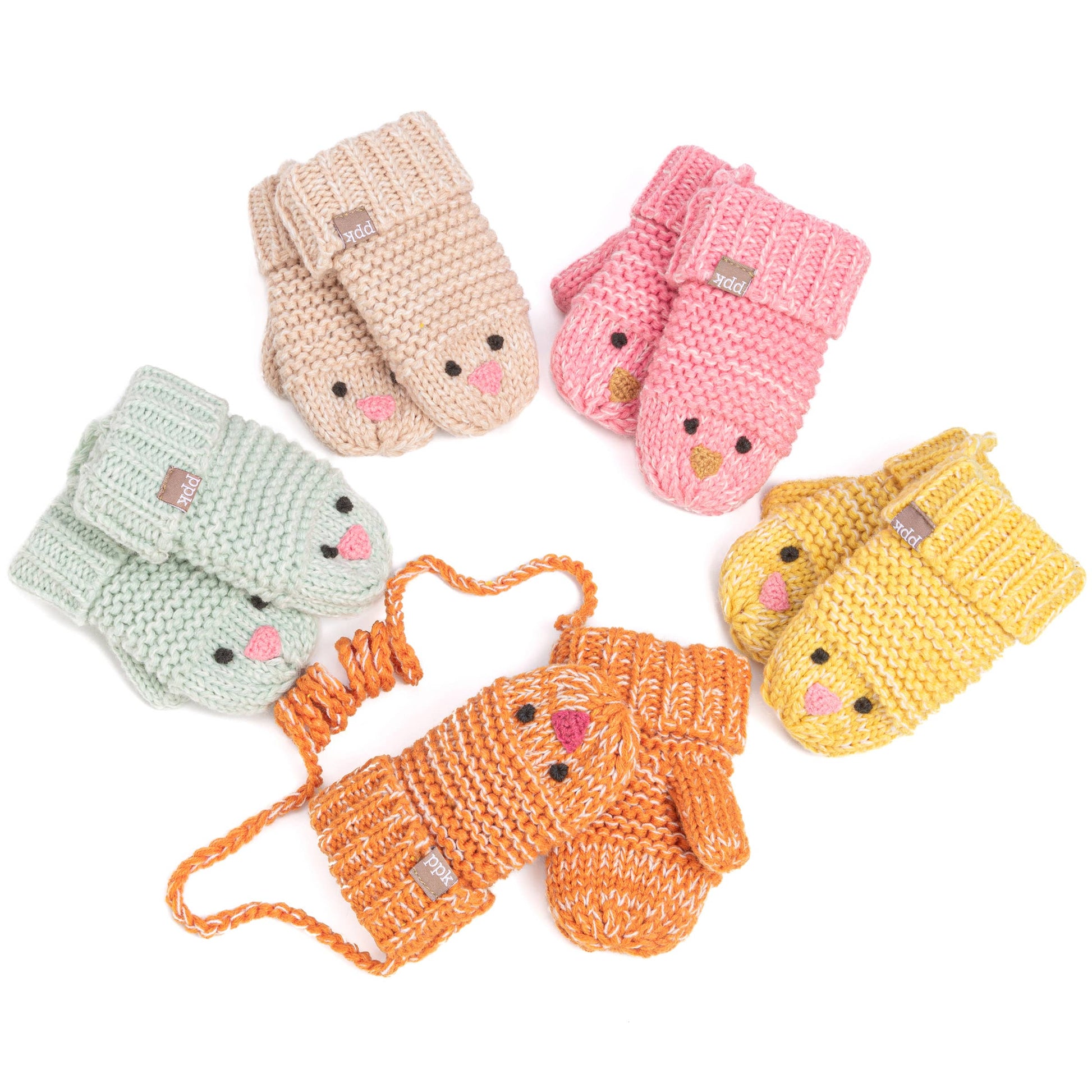 Set of colorful knitted baby mittens on a white background