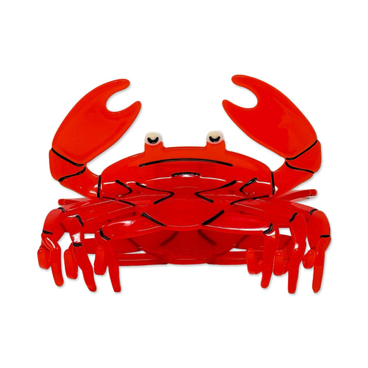 A bright red crab hair claw with black line details, small white eyes, and raised claws, centered on a plain white background.