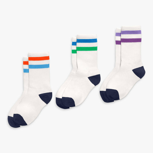 Three pairs of socks with colorful stripes on a white background