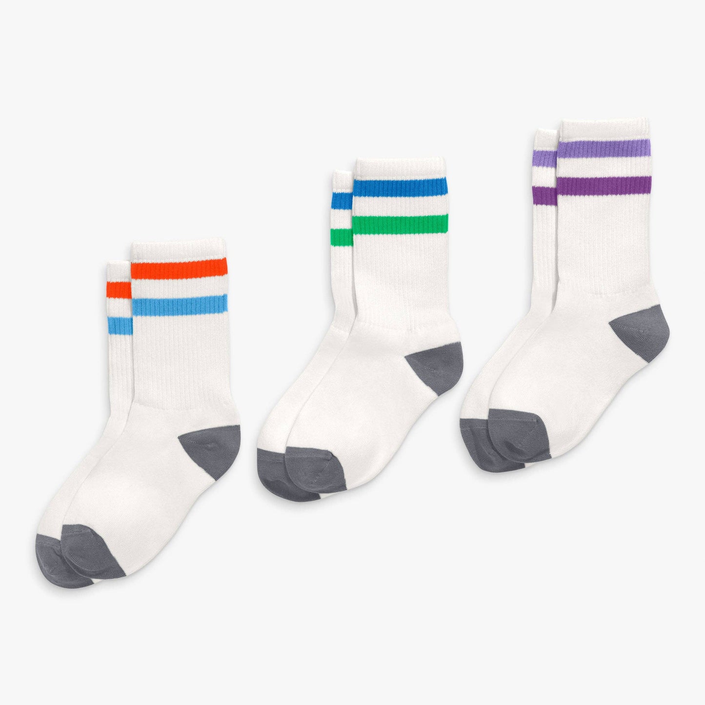 Three pairs of socks with colorful stripes on a white background