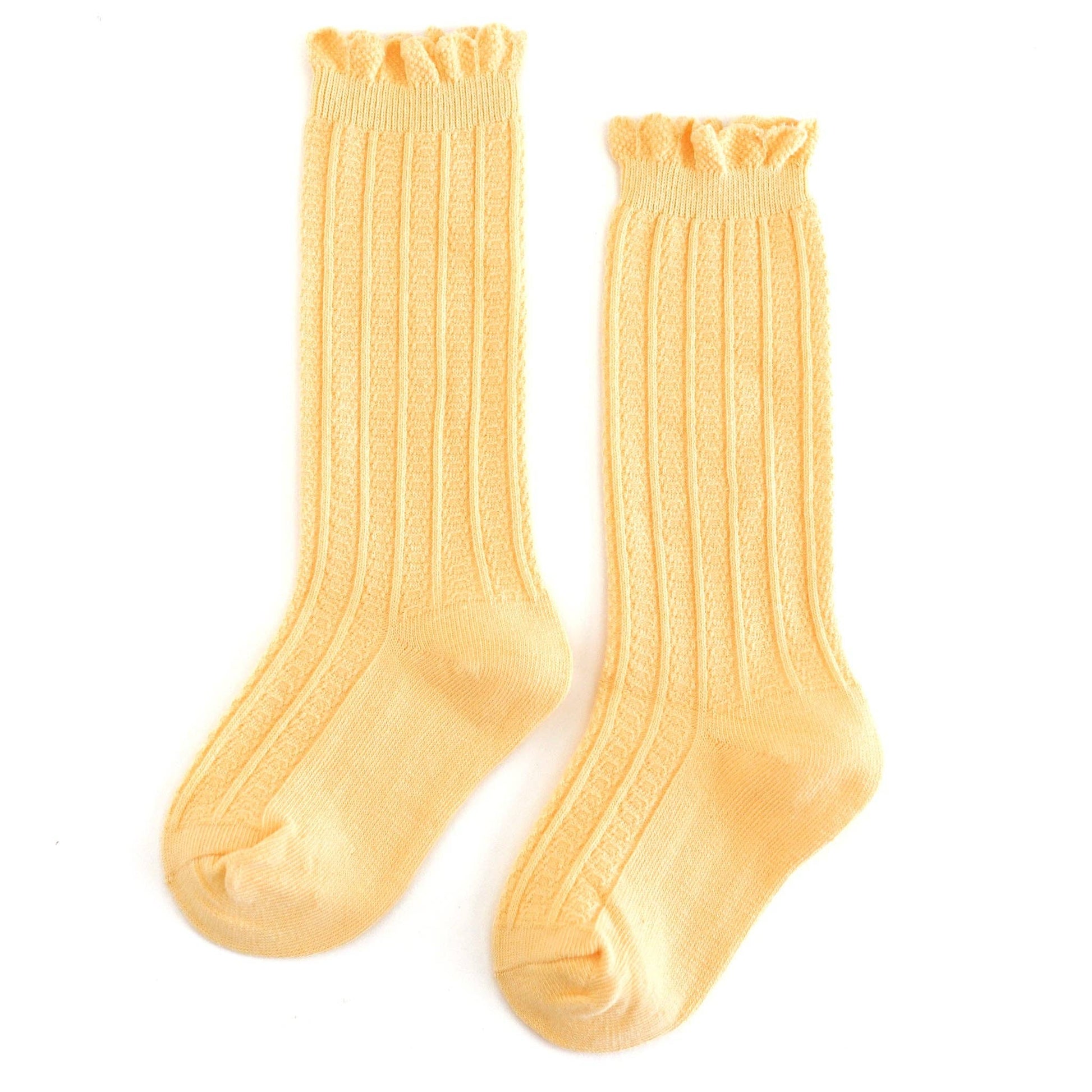 Pair of yellow socks on a white background