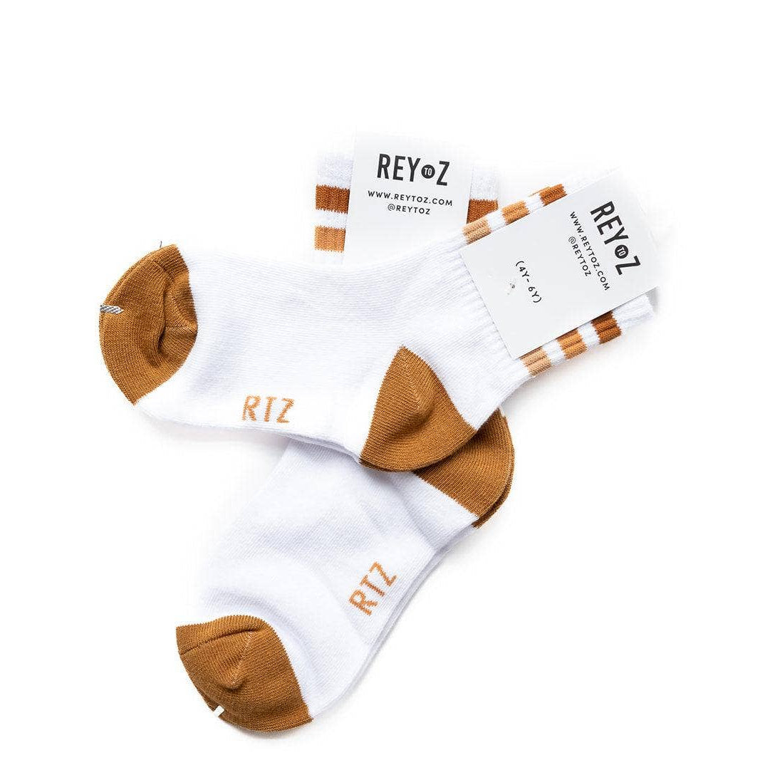 White socks with brown toes and heels on a white background, featuring the brand 'REY•Z'.